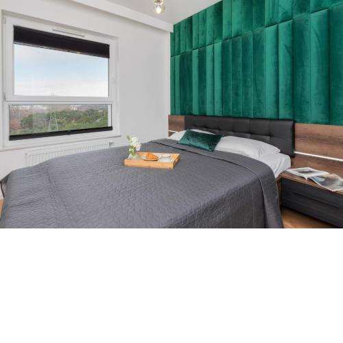 9th Floor Green and Grey Apartment in Gdańsk Brzeźno with Two Bedrooms and Parking by Noclegi Renters