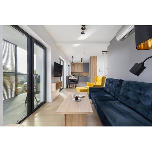 Air-Conditioned Seaside Apartment with Parking & Balcony by Noclegi Renters