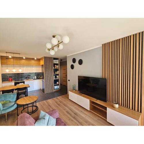 Apartament przy Loftach u Scheiblera parking podziemny, Śniadaniownia
