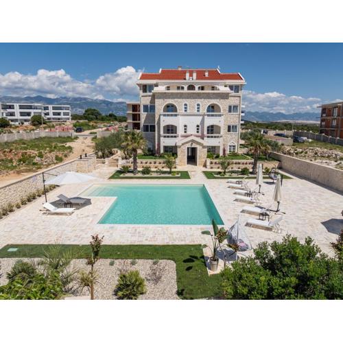 Apartments with a swimming pool Novalja, Pag - 24151