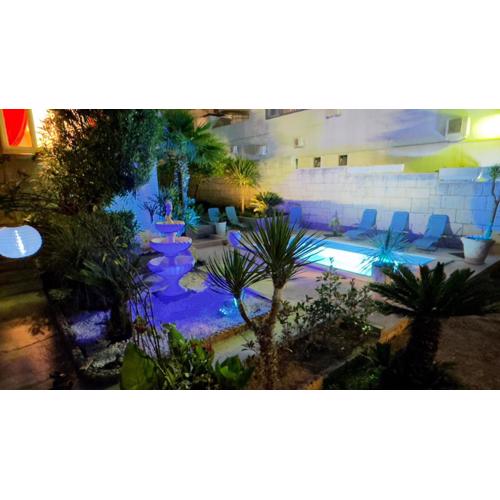Beach Villa Apartment on top location, with pool, sea view and exotic garden