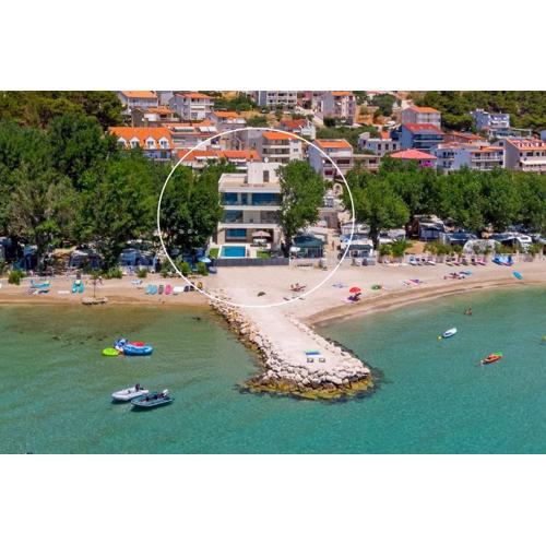 Beachfront Villa Erce with private 40sqm heated pool, a Gym, 7 en-suite bedrooms, a rooftop terrace, 2 living areas