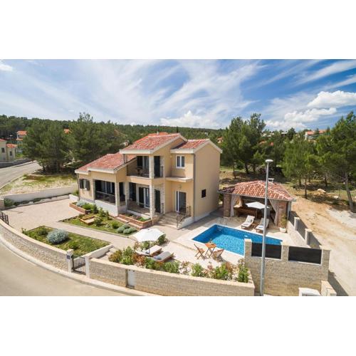 Beachfront villa Noa with heated pool
