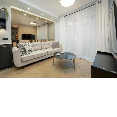 Black and Beige Apartment with Balcony and Parking in Wrocław by Noclegi Renters