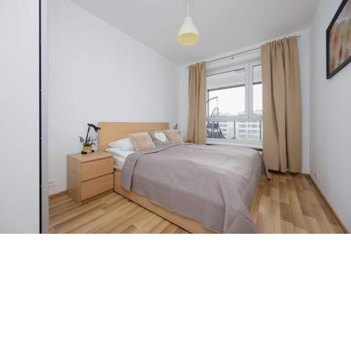 Bright Apartment with Parking near the PGE National Stadium by Noclegi Renters