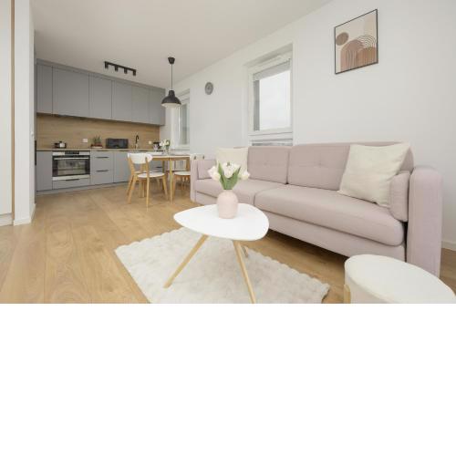 Bright Pastel Apartment with Desk for Remote Work, Balcony and Parking by Noclegi Renters