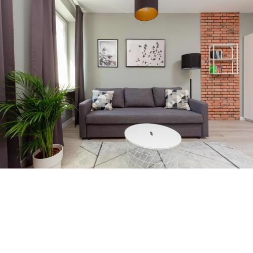 Central Apartment Emilii Plater by Noclegi Renters