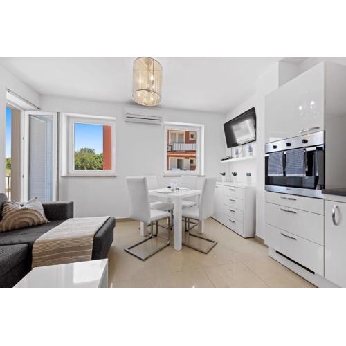 Charming White Apartment with Balcony and Parking