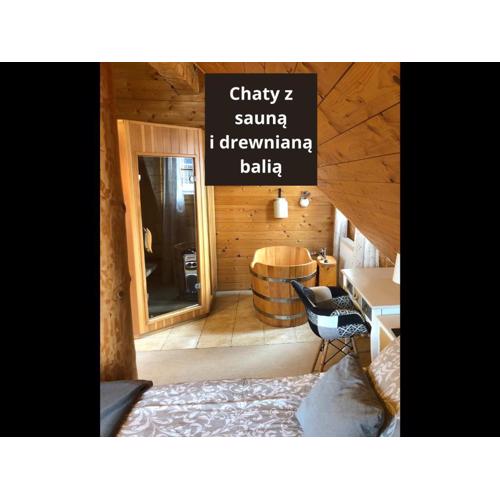 Chaty Świerkowe Wzgórze - domki typu superior z sauną balią kominkiem i domki-bez sauny balii kominka