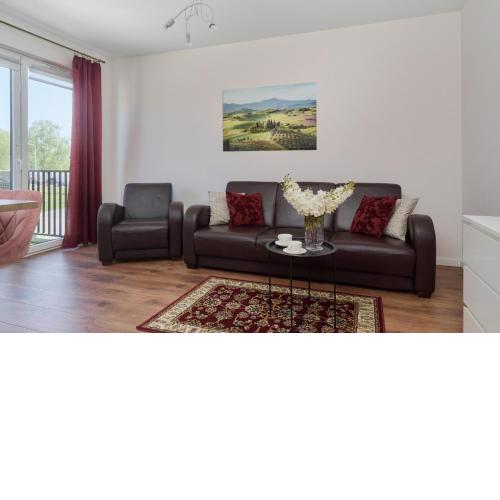 Comfy Apartment with Parking & Balcony by Noclegi Renters