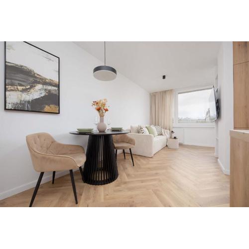 Cosy Apartment with Balcony near PGE by Noclegi Renters