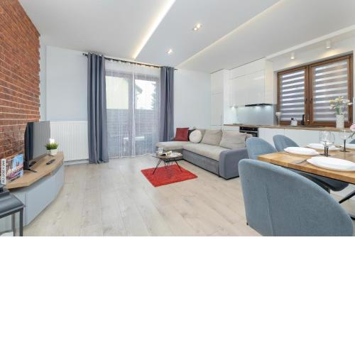 Cozy Apartment Pachonskiego with Balcony and Parking by Noclegi Renters