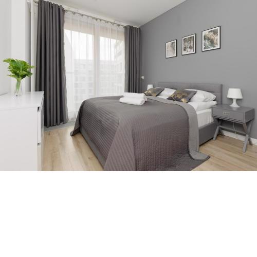 Cozy Apartments with Parking in the 19th District by Noclegi Renters