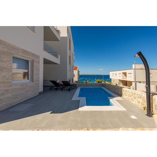 Dolphin view with a pool by the beach