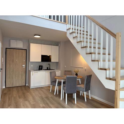 Dwupoziomowy apartament nr 24 z dużym balkonem i podziemnym parkingiem we Władysławowie