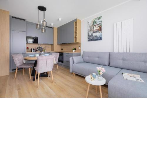 Elegancki Apartament w Krakowie z Klimatyzacją i Dostępem do Siłowni by Noclegi Renters
