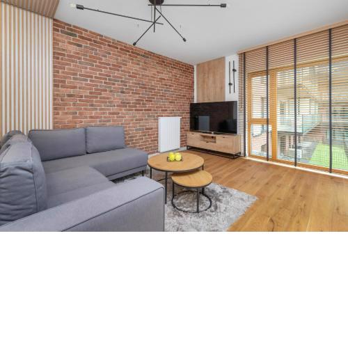 Elegant Apartment in Gdańsk with Sauna, Gym and Parking by Noclegi Renters