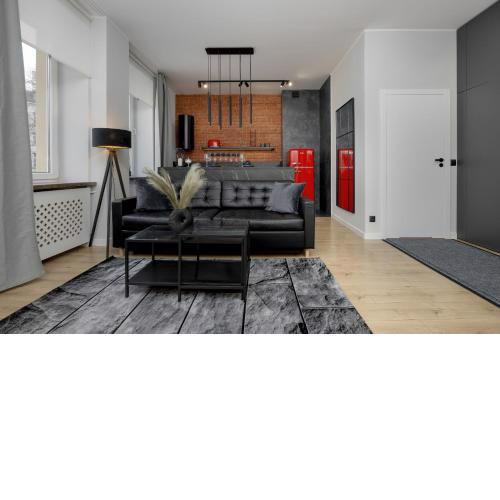 Exclusive Grey and Red Apartment in Warsaw Center by Noclegi Renters