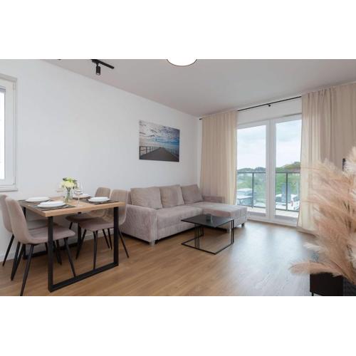 Family Apartment in Gdynia with Parking and Playground by Noclegi Renters