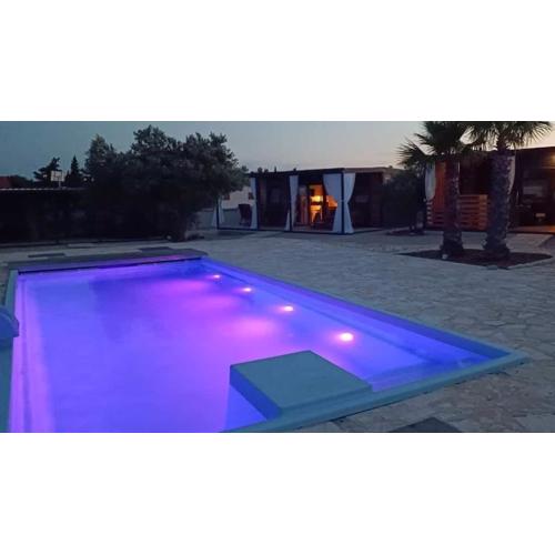Family-friendly apartments with swimming pools Pirovac, Sibenik - 24497