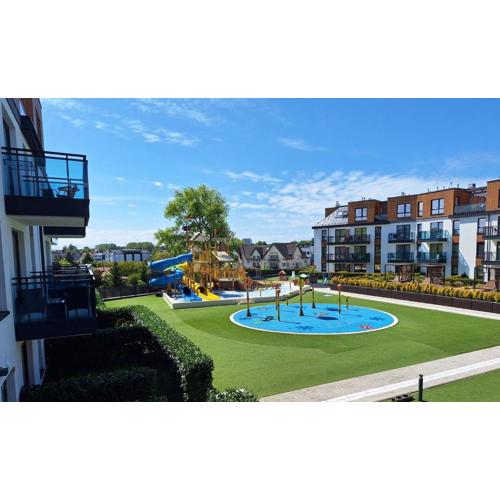 Family SUN & FUN Apartment & Water Park Patio at Belmare Aqua Resort