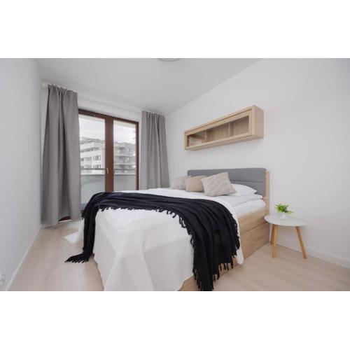 Functional Apartment with 2 Bedrooms and Parking in Wola district by Noclegi Renters