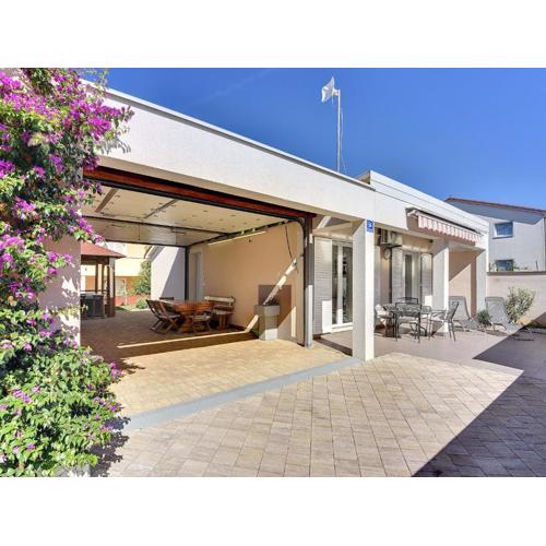 Holiday home with terrace and outdoor kitchen