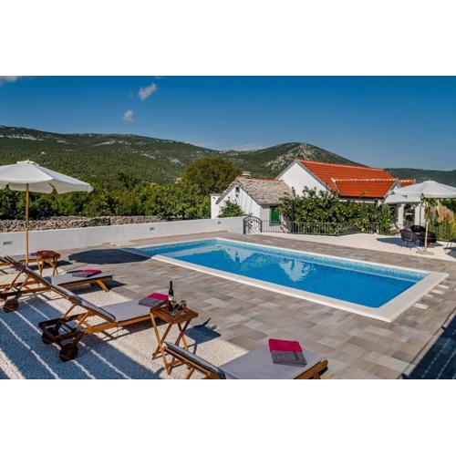 House Camellia with fenced pool and playground