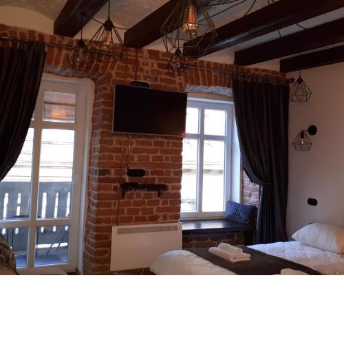 Loft апартаменти з балконом в центрі Львова