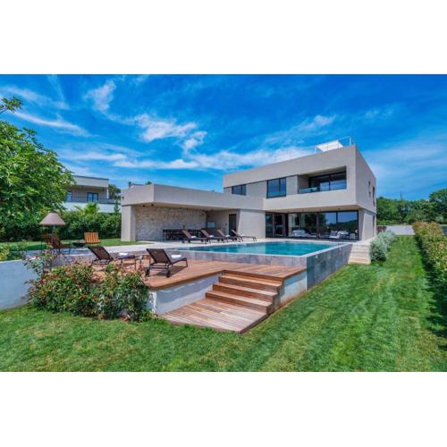 Luxury beachside villa with a pool and a sea view