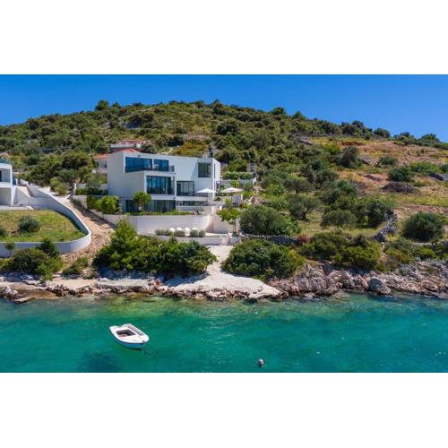 Luxury Seafront Villa Roots with private, heated pool, 5 en-suite bedrooms, enchanting sea views