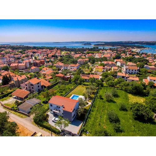 Luxury villa Medulin with pool near the beach , sea view, extra pool heating available