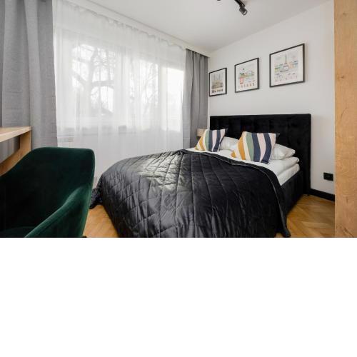 Modern Black & Wooden Apartment Warsaw Near The Airport by Noclegi Renters