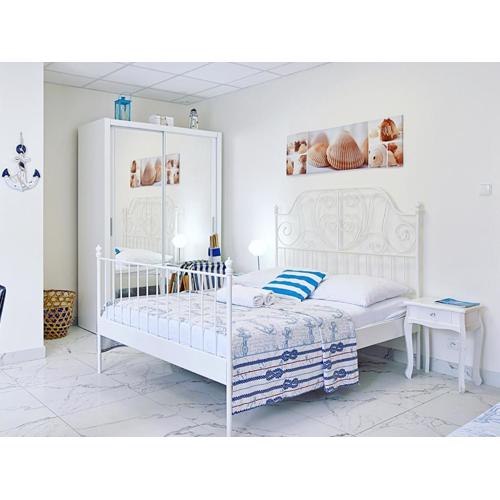 Muszelka pokoje i apartamenty
