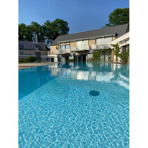 Paradies in den Südsteirischen Weinbergen: Bezauberndes Apartment mit Terrasse, Infinity Pool-Zugang, Sauna und Fitnessbereich!