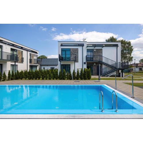Paraiso Nadmorskie Apartamenty z Basenem i Parkingiem by Noclegi Renters