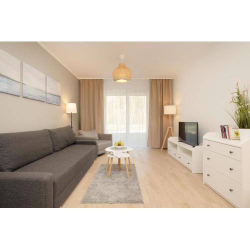 Plażowa Park Apartment with Garden by Noclegi Renters