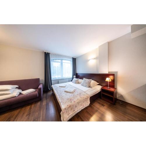 Pokoje i apartamenty ,,Leśne\