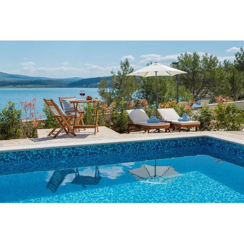 Seafront villa Noah with heated pool