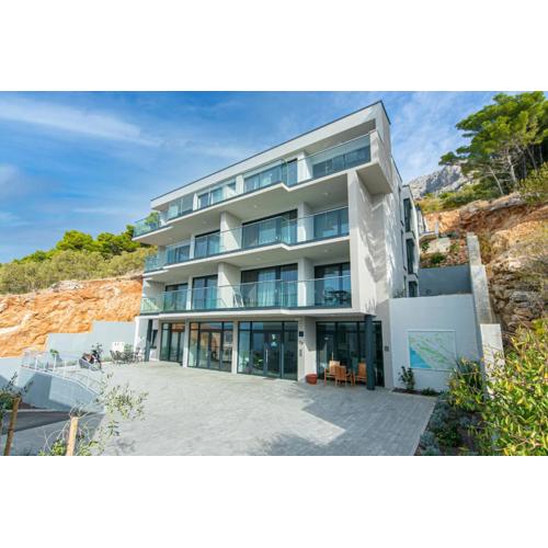Seaside apartments with a swimming pool Brela, Makarska - 20229