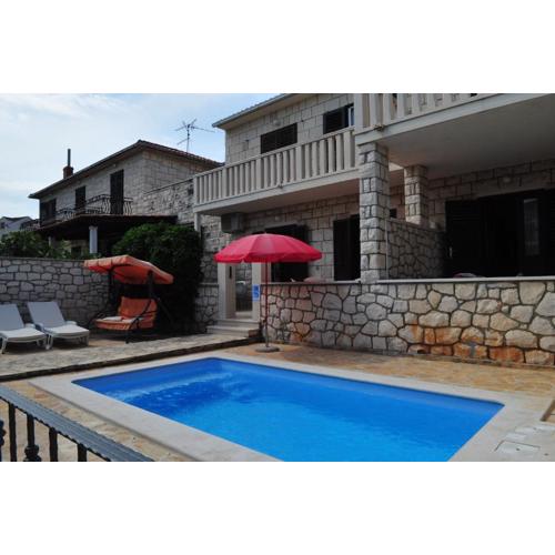 Seaside apartments with a swimming pool Supetar, Brac - 11360