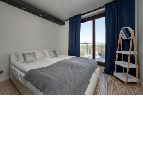 Spacious Apartment Located near Racławice Panorama by Noclegi Renters