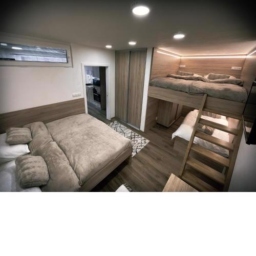 U Králíka, přízemní bezbarierové apartmány A,B,C,D - 50 metrů od vleku - přejdete v lyžácích, pod bobovou dráhou, parkování zdarma, lyžárna s vysoušeči bot,