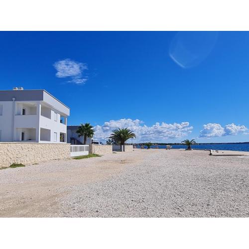 Via apartment first row by the sea