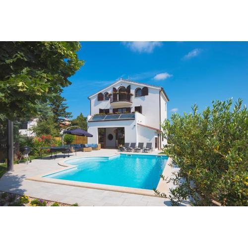 Villa Andrija Family Dream with heated pool at the sea with beautiful garden, outside cinema and kids playground