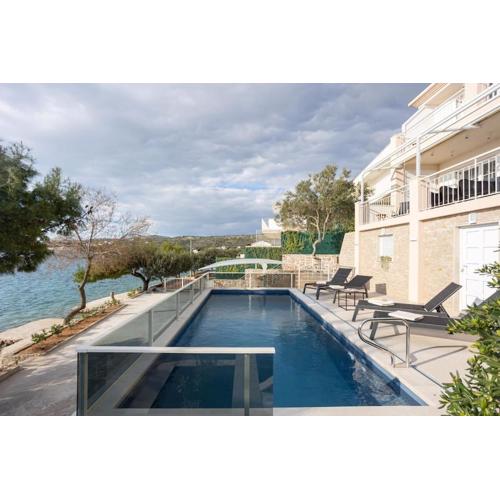 Villa Sea Touch - beachfront, with a heated pool