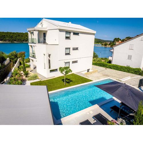 Villa Veronica with pool and boat mooring first line at sea