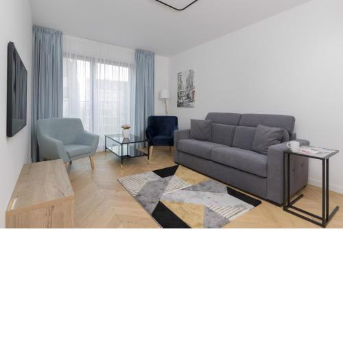 Warsaw Praga Okrzei Apartment by the River by Noclegi Renters