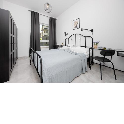 Wyjątkowy Apartament z Uroczym Ogródkiem oraz Parkingiem by Noclegi Renters