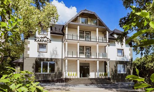 Poľské Krkonoše vo Ville Karpacz s polpenziou a vstupenkou do aquaparku + zľava na výlety a fľaša vína